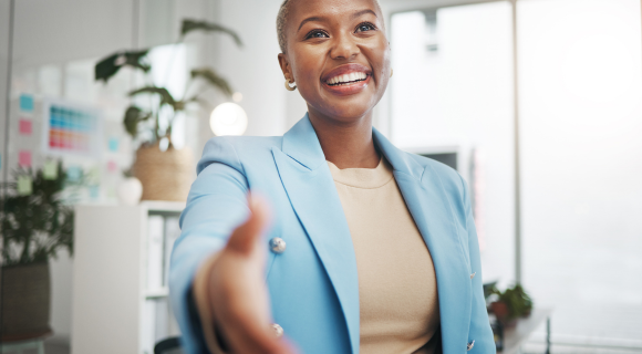 Female holding doing a handshake greeting